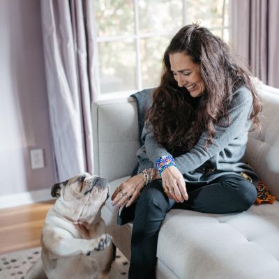 Sharon playing with her companion dog.